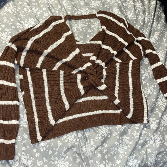I'm selling a cross back sweater. Fun for that fall look. Off the market soon. - Picture 1 of 3